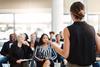 woman-stood-in-front-of-crowd