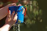Child's hands holding leaky bucket
