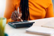 Woman using calculator