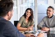 Smiling clients at meeting with solicitor