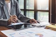 Business woman calculates costs