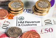 Image of coins on top of a HMRC document