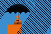 Rainy scene with bag of money being covered by an umbrella