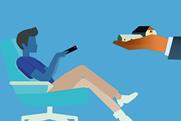 The illustration depicts a person sitting in an office chair, pointing a remote control at a television screen. An arm extends from the screen, holding two miniature houses in its hand