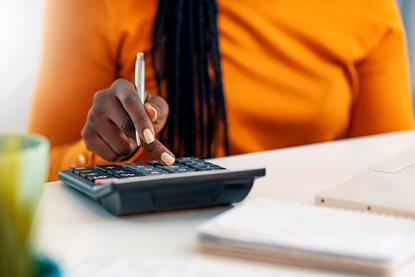 Woman using calculator