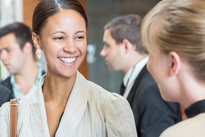 smiling-solicitors-talking-at-networking-event-530686149