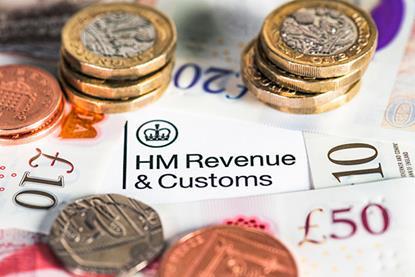 Image of coins on top of a HMRC document