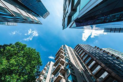Image looking up at buildings against the sky