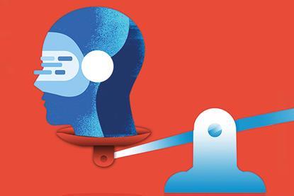 A metallic head wearing a headset is weighed on a scale