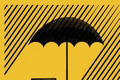 Insurance - umbrella sheltering broker's desk from rain