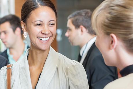smiling-solicitors-talking-at-networking-event-530686149