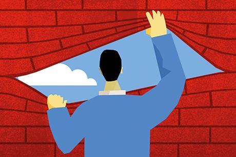 Boundaries: man looking at blue sky through hole in brick wall