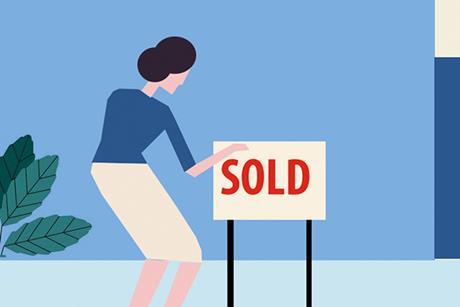 SDLT: woman placing "sold" sign outside house