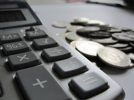 calculator and coins