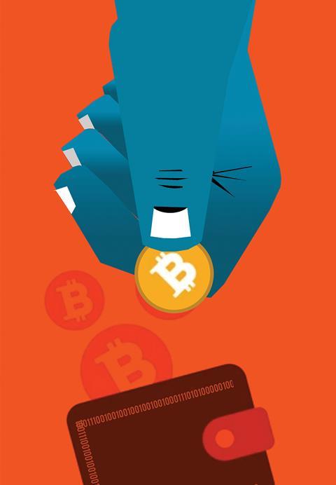 Graphic of a large hand holding a gold bitcoin over a wallet